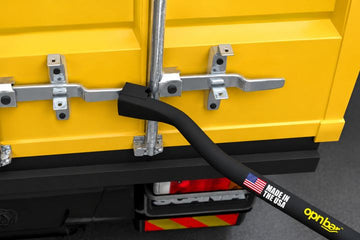 OPNBar seated on a container door handle between closely spaced lockrods